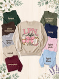 LPN LIFE sweatshirt in Sand with nine labeled color options